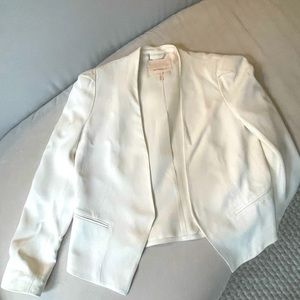 White RT size 2 blazer. Slight shoulder padding. Small stain on arm, see photo.